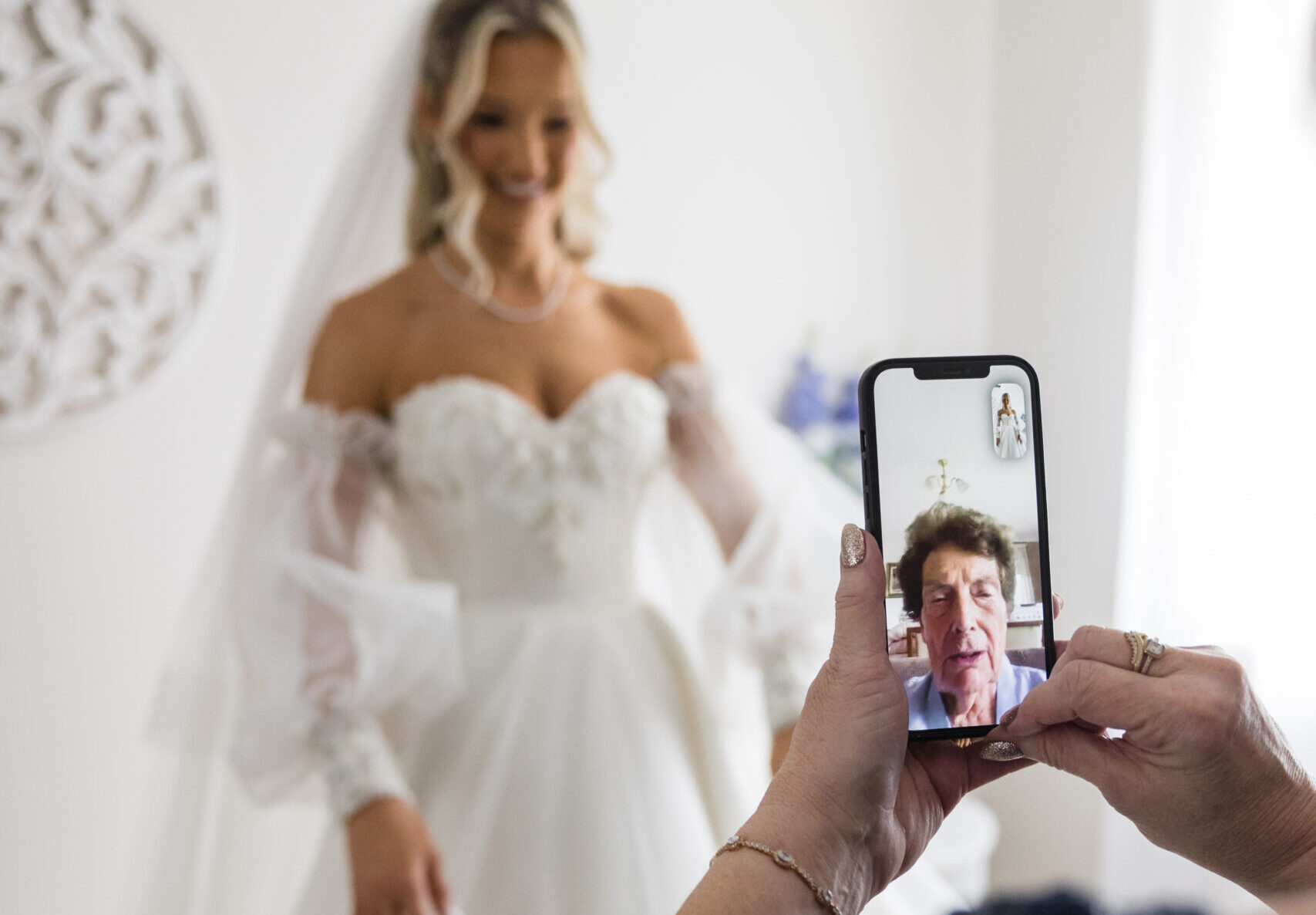 Bride Facetiming her grandmother during preparations